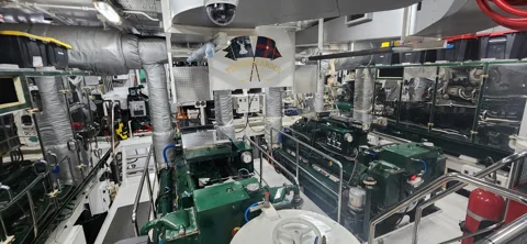 Engine-room machinery with polished metal pipework