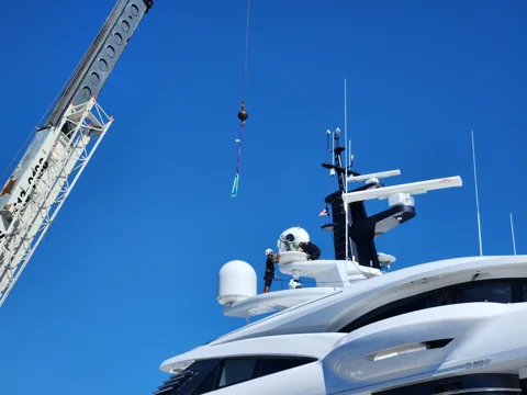 Crane access alongside a yacht superstructure