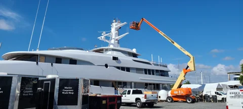 Extended aerial lift access to a yacht superstructure