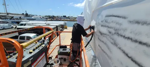 Hull preparation alongside the dock