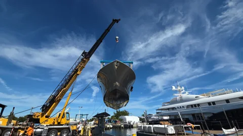 Crane lifting a tender