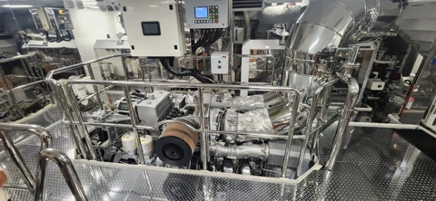 Engine-room machinery with polished pipework and service access