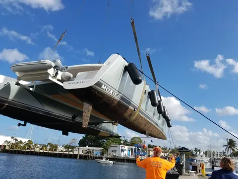 Crane lifting a tender at the yard