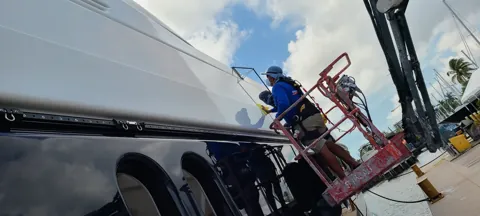 Aerial lift access alongside the hull