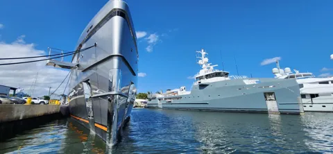 Sailing yacht alongside the yard