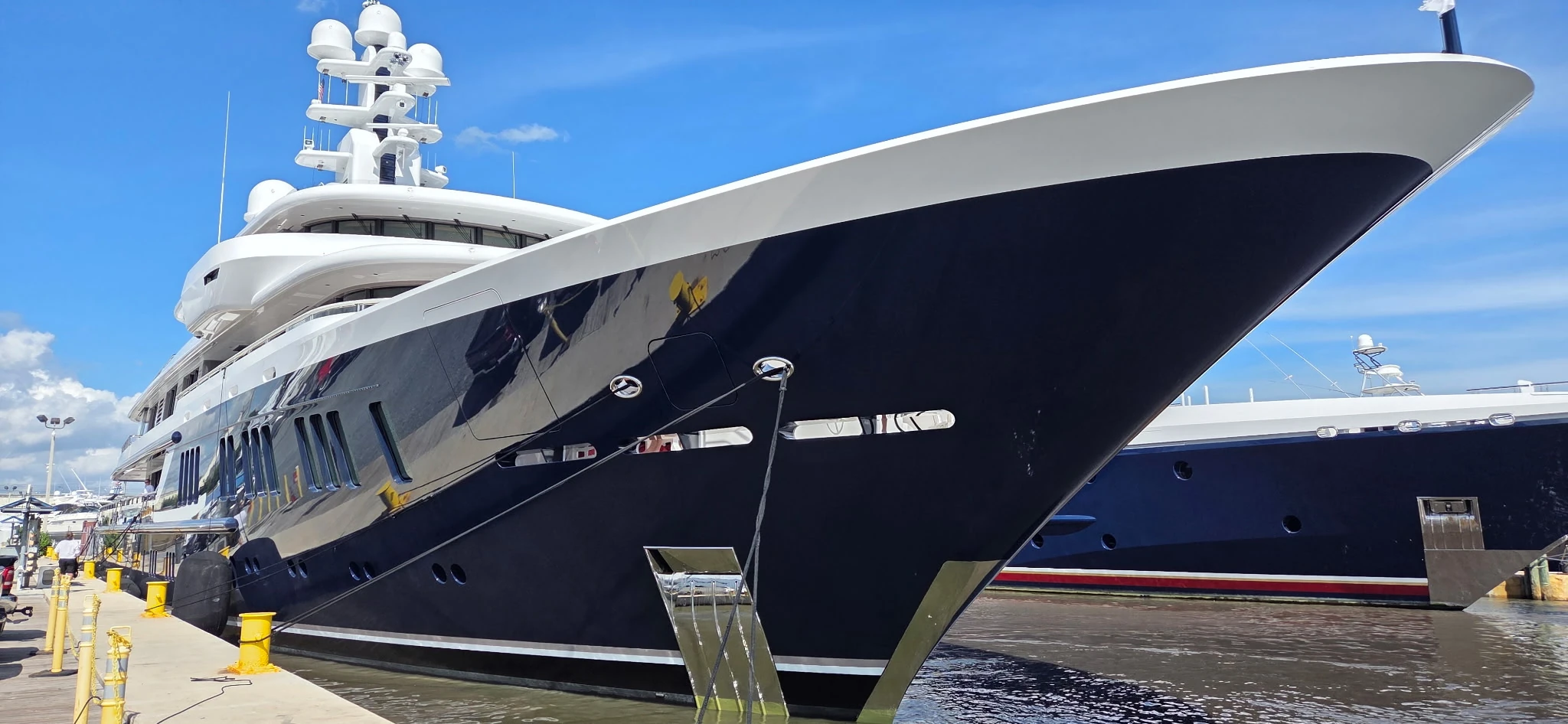 Dark-blue superyacht berthed at Taylor Lane Yacht and Ship